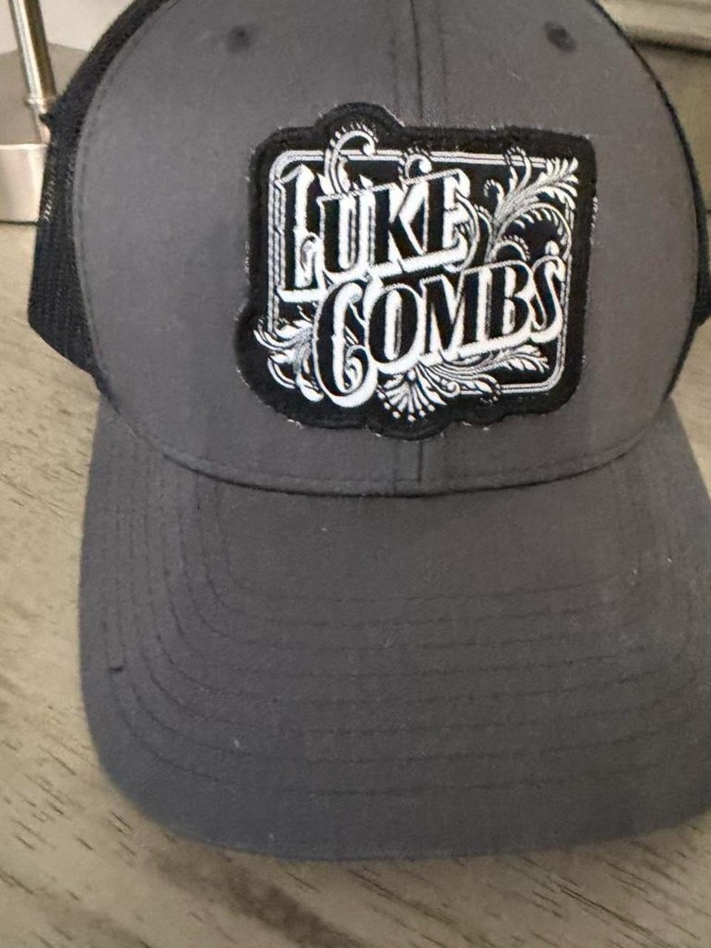 The Classic Black Mesh Trucker Hat with Gold Logo